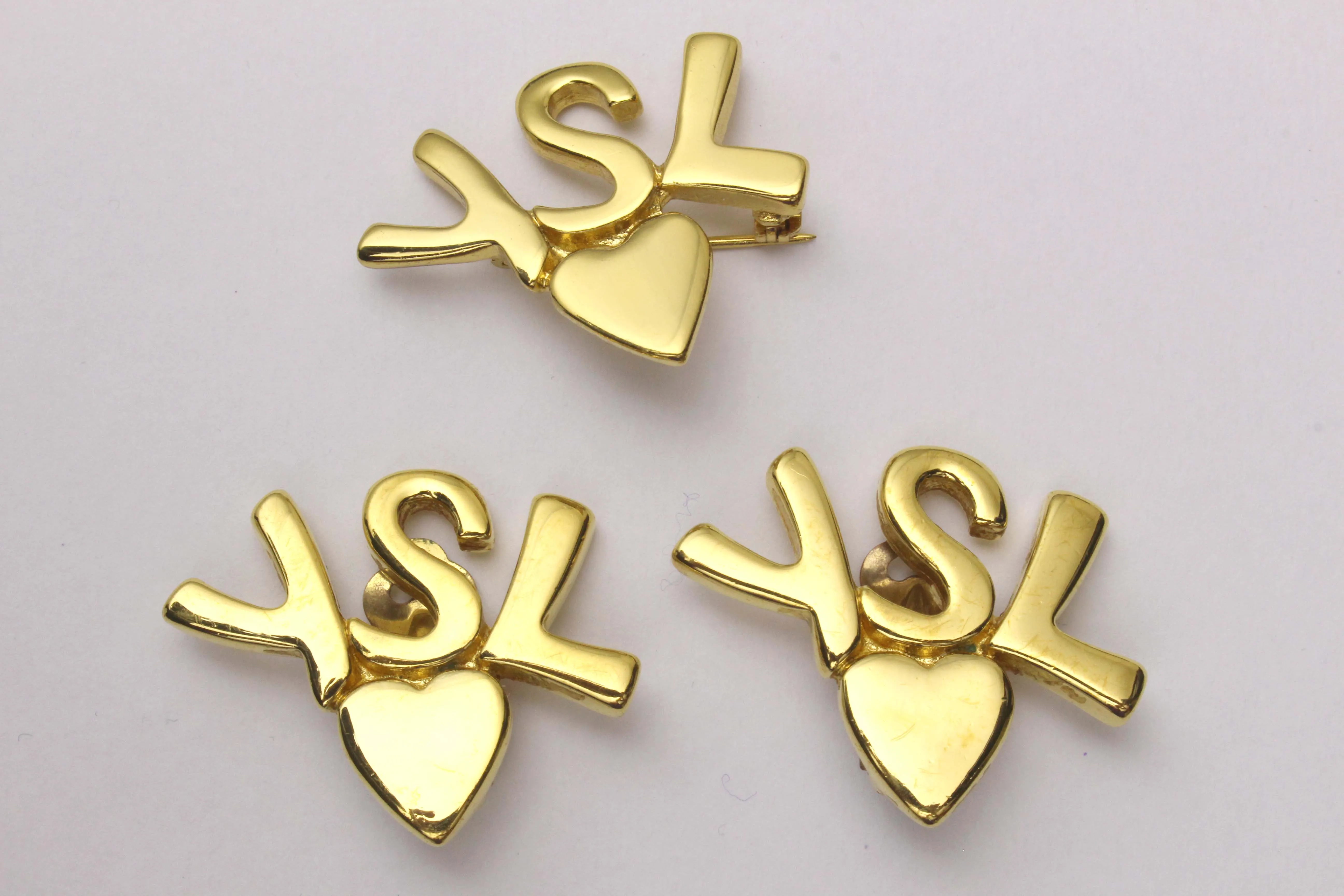 YVES SAINT LAURENT initials over heart set